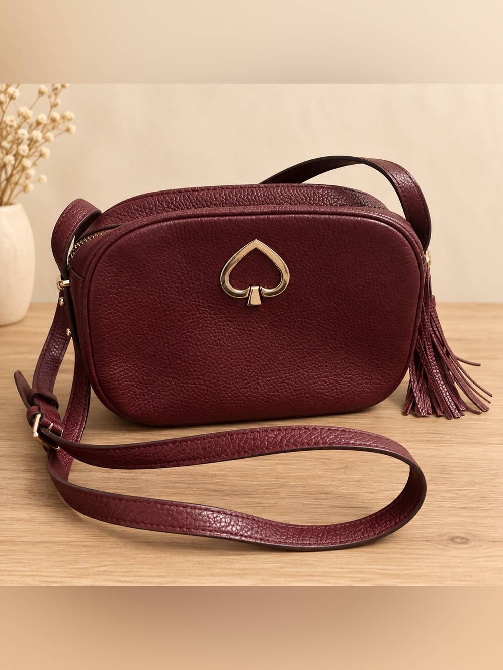 kate spade Maroon Leather Crossbody with Spade accent.